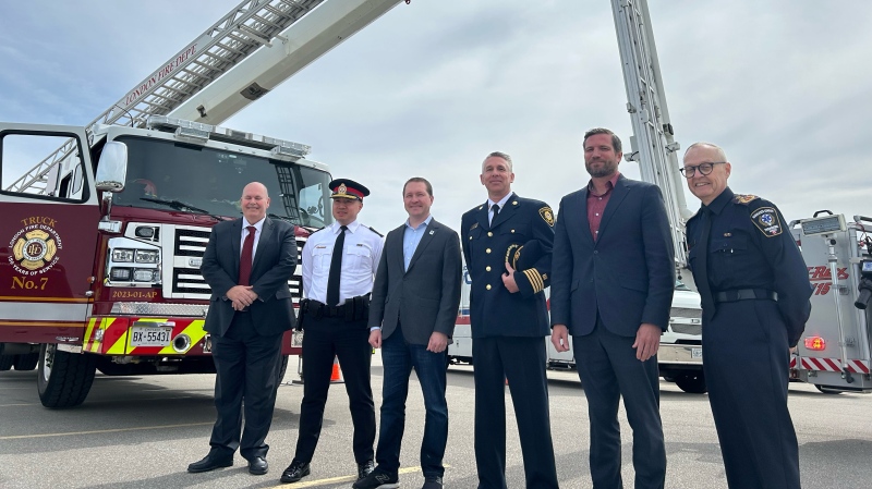 Members of London’s emergency preparedness team pose in front of London’s newest aerial firetruck at an event to kick off emergency prepared this week. May 6, 2024. (Sean Irvine/CTV News London) 