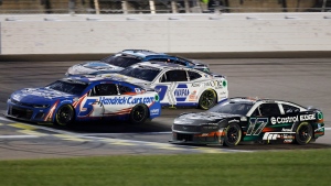 Kyle Larson crosses the finish line 0.001 in front of Chris Buescher for the closest win in NASCAR Cup Series history. (Colin E. Braley / AP via CNN Newsource)