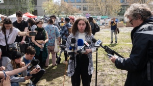 A spokesperson for pro-Palestinian activists speaks to the media at the encampment on McGill University campus Monday, May 6, 2024 in Montreal. THE CANADIAN PRESS/Ryan Remiorzv
