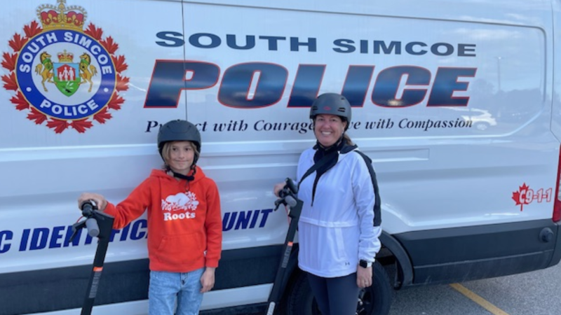 Young Kaiden and his mother Samantha are shown after turning in a large amount of cash they discovered on Sun. May 5, 2024 (Courtesy: South Simcoe Police Service). 