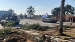 A tank with an Israel flag is seen entering the Gazan side of the Rafah border crossing on Tuesday, May 7, 2024. (Israel Defense Forces via AP)