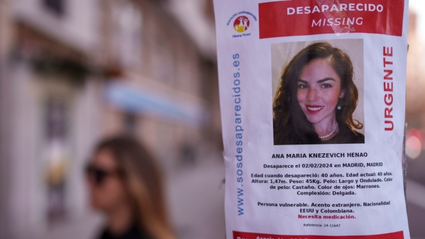 A banner of a Colombian-born American missing woman Ana Maria Knezevich Henao, 40, is displayed on a streetlight in Madrid, Spain, Feb. 16, 2024. (AP Photo/Manu Fernandez) 