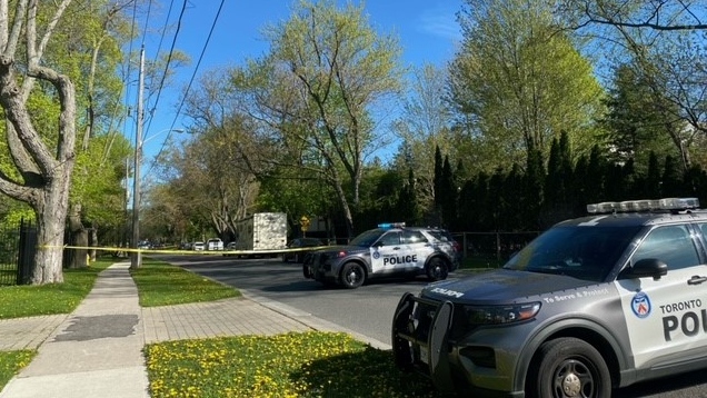Toronto police conduct an investigation outside Drake's Toronto mansion on May 7, 202.
