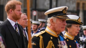 Prince Harry walks with King Charles III and Princes Anne behind the coffin of Queen Elizabeth II at Westminster Abbey, Monday Sept. 19, 2022. (Emilio Morenatti / AP Photo, Pool)