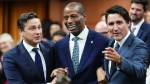 File photo of newly-elected Speaker of the House of Commons Greg Fergus is escorted into the House of Commons by Prime Minister Justin Trudeau and Conservative Leader Pierre Poilievre on Parliament Hill on Oct. 3, 2023 (Sean Kilpatrick / THE CANADIAN PRESS)