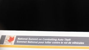 A name tag shows the title of the National Summit on Combatting Auto Theft being held in Ottawa, Thursday, Feb. 8, 2024.