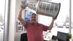 Shane Osepchuk holds a replica of the National Hockey League's Stanley Cup during an interview with CTV News Edmonton. (Evan Kenny / CTV News Edmonton) 