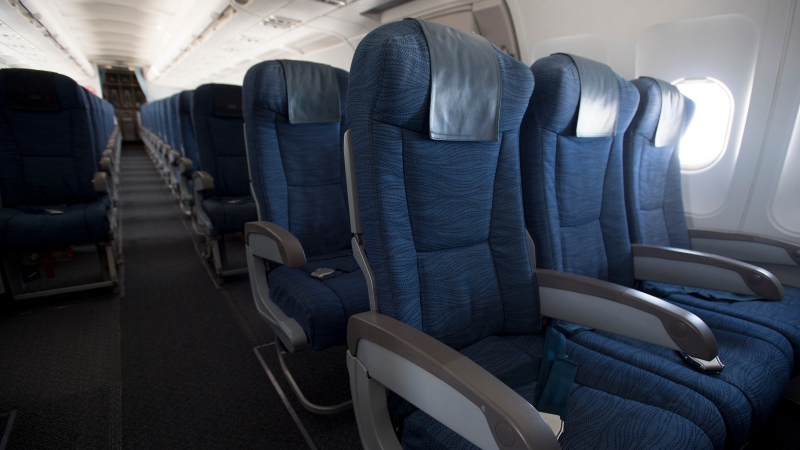 Empty seats are seen during a flight from Vancouver to Calgary, Tuesday, June 9, 2020. THE CANADIAN PRESS/Jonathan Hayward