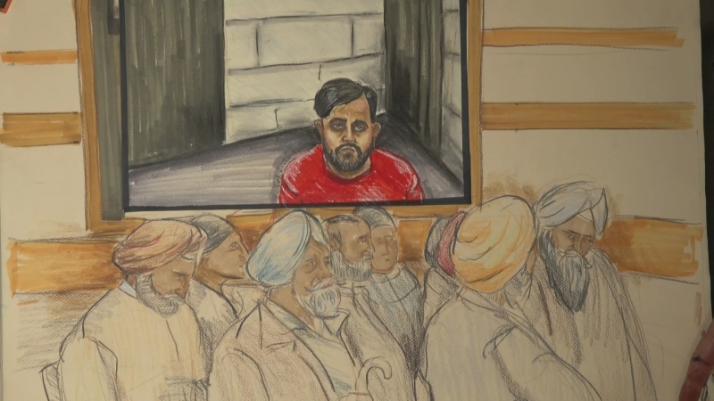 One of the three men charged with killing Hardeep Singh Nijjar appears by video in a Surrey, B.C. courthouse, where supporters of the slain activist gathered on May 7, 2024. 