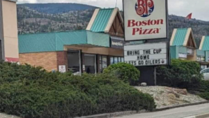 A sign at a Boston Pizza in Penticton, B.C., that cheered on the Edmonton Oilers has been updated to support the Vancouver Canucks. 