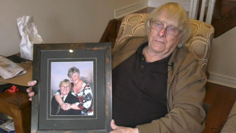 John Richards holds a photo of his late wife of 50 years, Sandra Richards, in Uxbridge, Ontario.
