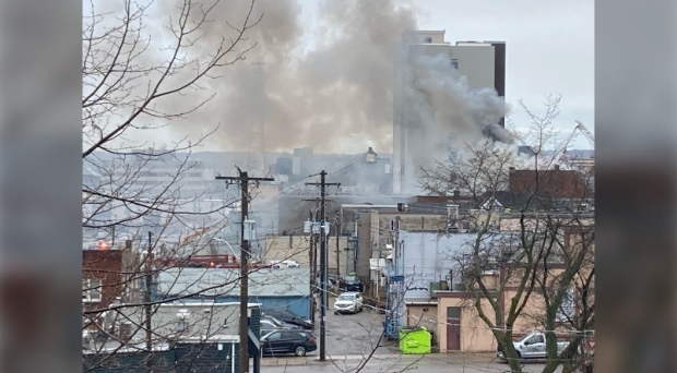 Grey smoke billows from Queen Street East building in downtown Sault Ste. Marie after a fire broke out Wednesday morning. May 8, 2024 (Mike McDonald/CTV Northern Ontario)