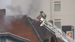 Sault Ste. Marie firefighter on ladder at Queen Street fire. May 8, 2024 (Mike McDonald/CTV Northern Ontario)