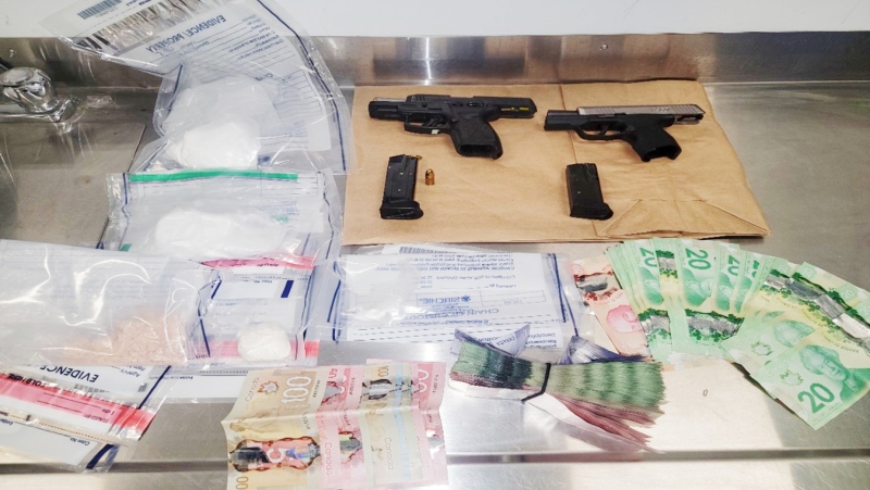 Items seized by police in North Bay include 250.8 grams of cocaine, 43.2 grams of fentanyl, $8,600 in cash and two loaded 9mm handguns. (Photo courtesy of the North Bay Police Service)