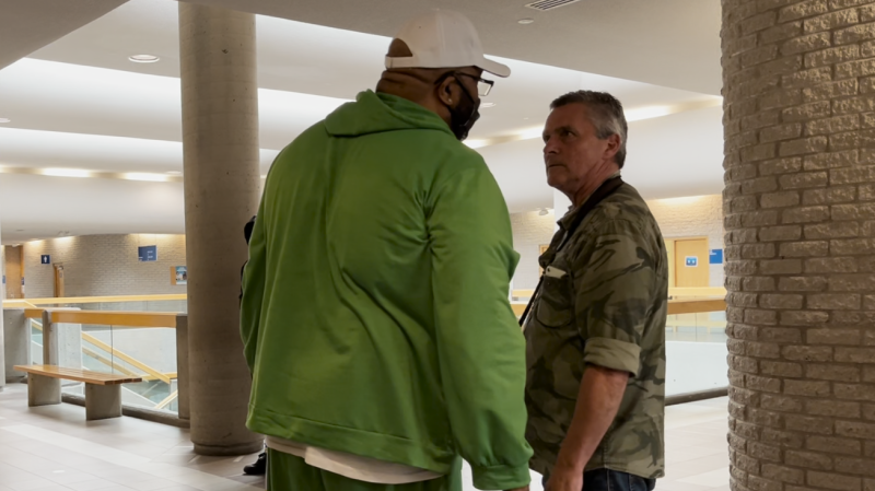 Ugochukwu Chijoke 'Gouchy Boy' Onyechekwa confronts Journal de Montreal photographer Pierre-Paul Poulin after the convicted sex offender and actor threw his walker at the photographer at the Longueuil courthouse on Wednesday, May 8, 2024. (Stephane Giroux/CTV News)