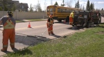 City crews patching up a pothole as a repair blitz gets underway on May 8, 2024. (Noah Rishaug / CTV News)