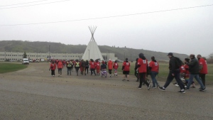 Hundreds of supporters walked towards the Treaty Four Governance Centre in honour of MMIGW. (Mick Favel / CTV News)