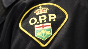 An Ontario Provincial Police logo is shown during a press conference, in Barrie, Ont., April 3, 2019. THE CANADIAN PRESS/Nathan Denette