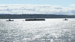 A barge drifted toward English Bay on Tuesday, May 7. 