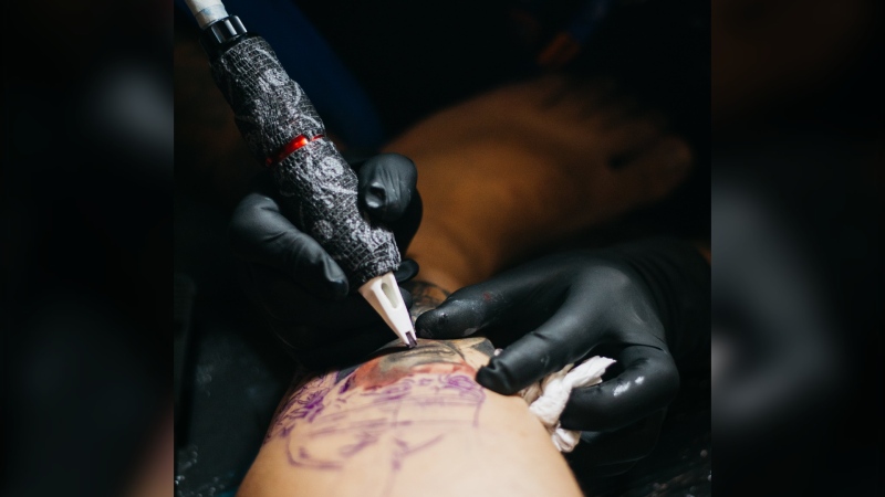 A generic photo of a person receiving a tattoo. (Source: Anderson Cavalera/Pexels)