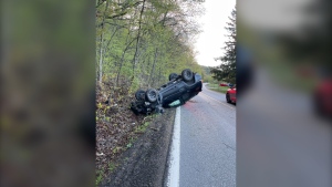 Police in western Quebec say a vehicle crashed into a tree and rolled over on chem de la Montagne in Chelsea, Que. on Thursday. (MRC des Collines de l'Outaouais police/release)