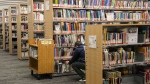 Books line shelves at the North York Central Library in Toronto on Friday, February 23, 2024. (THE CANADIAN PRESS/Chris Young)