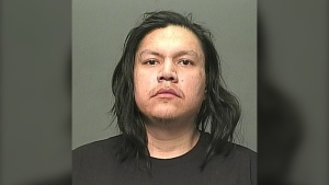 Tyron Custer Harper, 30, is shown in an undated photo provided by the Winnipeg Police Service. 