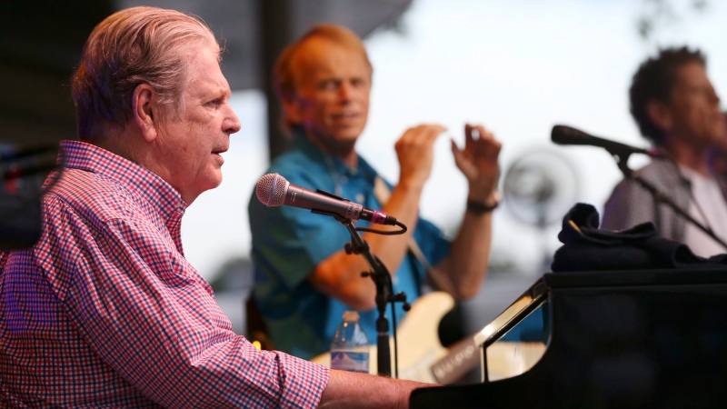 Brian Wilson performs with The Beach Boys co-founder Al Jardine, background center, at Elmwood Park Amphitheater in Roanoke, Va., on Saturday, Aug. 20, 2016. (Heather Rousseau/The Roanoke Times via AP) 