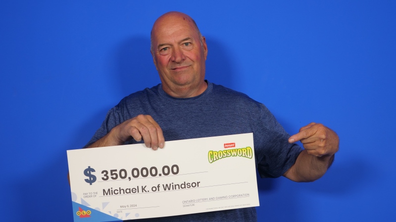 Mike Kennedy collects his lottery winnings. (Source: OLG)