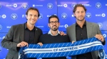 CF Montreal President and Chief Executive Officer Gabriel Gervais, left, Vice-President and Chief Sporting Officer Olivier Renard, right, and Hernan Losada hold up CF Montreal scarf following a news conference in Montreal, Thursday, December 22, 2022. CF Montreal is parting ways with Renard, the Major League Soccer club announced Thursday. THE CANADIAN PRESS/Graham Hughes
