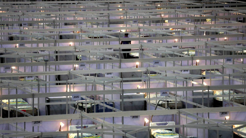 Hundreds of beds are lined up at a temporary field hospital set up at the Asia World Expo in Hong Kong, Saturday, Aug. 1, 2020. (AP Photo/Kin Cheung, File)