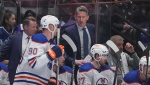 Edmonton Oilers head coach Kris Knoblauch talks to Corey Perry (90) during Game 1 of against the Canucks in Vancouver on Wednesday, May 8, 2024. THE CANADIAN PRESS/Darryl Dyck