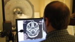 A health-care worker examines results from an MRI. (Source: Communications Nova Scotia / File)