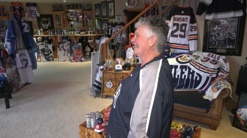 Patricia Lesyk in her home's basement, which features a large collection of Edmonton Oilers and hockey-related memorabilia. (Dave Mitchell/CTV News Edmonton)