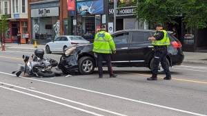 A motorcycle is damaged on the street after a crash in Cambridge on May 10, 2024. (CTV News/Dan Lauckner)