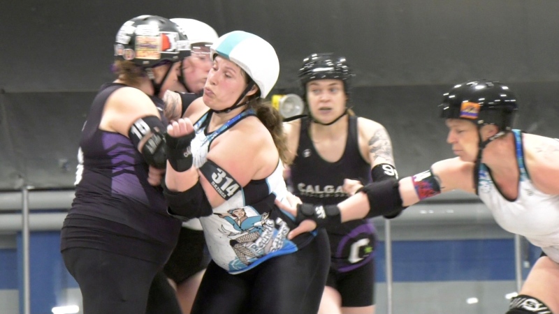 Calgary Allstars in black take on Saskatoon's Redneck Betties at the 11th annual Fast Track Fever roller derby tournament May 10 to 12, 2024 at the Acadia Recreation Complex.