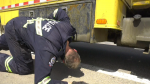 An Edmonton police officer carries out a commercial vehicle inspection on May 8, 2024. (Matt Marshall/CTV News Edmonton)