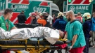Paramedics transport injured commuters after two trains collided in Buenos Aires, Argentina, Friday, May 10, 2024. (AP Photo/Natacha Pisarenko)