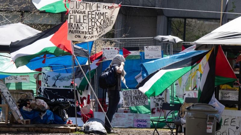 Palestinian activists at their encampment on McGill University campus Monday, May 6, 2024 in Montreal. (Ryan Remiorz, The Canadian Press)