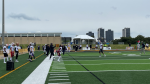 Players on Warrier Field ahead of the East-West Bowl at the University of Waterloo on May 11, 2024. (Hannah Schmidt/CTV Kitchener)