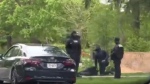 A still from a viewer video show a man on the ground detained by security guards outside Drake's mansion in Bridle Path on Saturday, May 11, 2024. (Devon Selfe)