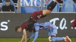Toronto FC defender Sigurd Rosted (17) falls over New York City forward Malachi Jones (88) during first half MLS action in Toronto, Saturday, May 11, 2024. THE CANADIAN PRESS/Frank Gunn
