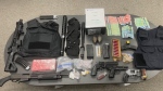 Weapons, drugs and cash seized by the New Westminster Police Department are pictured in this handout photo. 