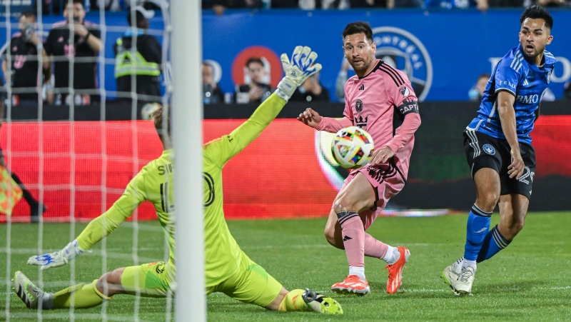 Inter Miami forward Lionel Messi (10) takes a shot on CF Montreal goalkeeper Jonathan Sirois (40) as CF's Mathieu Choiniere (29) looks on during second half MLS soccer action in Montreal, Saturday, May 11, 2024. (Graham Hughes, The Canadian Press)