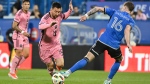 Inter Miami's Lionel Messi, left, gets by CF Montreal defender Joel Waterman (16) during first half MLS soccer action in Montreal, Saturday, May 11, 2024. (Graham Hughes, The Canadian Press)