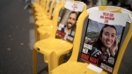 A poster of Noa Argamani is taped to one of the empty chairs for hostages held by Hamas in the Gaza Strip as relatives and their supporters gather together to mark the start of Shabbat, outside of Israeli Prime Minister Benjamin Netanyahu's official residence to call for an immediate deal to release their loved ones, in Jerusalem, Friday, May 10, 2024. (AP / Maya Alleruzzo)