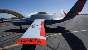 FILE - The XQ-67A Off-Board Sensing Station unmanned aerial vehicle, one prototype of the future AI drone fleet developed under the USAF's Air Force Research Laboratory, is displayed at General Atomics' test facility at Gray Butte in Palmdale, Calif., on Wednesday, May 1, 2024. (AP Photo/Damian Dovarganes, File)