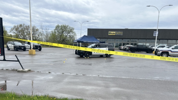 A heavy police presence and yellow police tape is still visible around the Westside Plaza parking lot at the corner of Peoples Road and Second Line West in Sault Ste. Marie, Ont. on Sunday following a fatal police shooting on Saturday. May 12, 2024. (Cory Nordstrom/CTV News Northern Ontario)