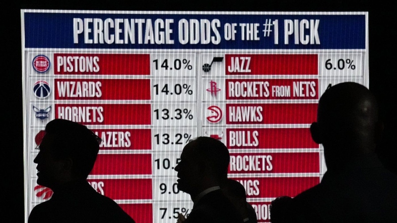 People look at the NBA basketball draft lottery. (Nam Y. Huh/AP Photo)