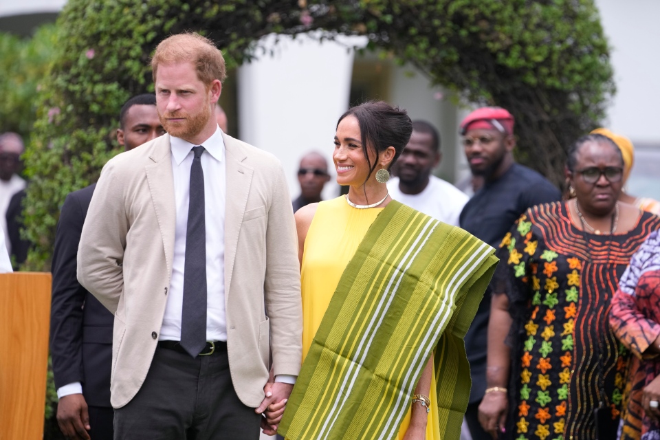 Prince Harry and Meghan holding hands
